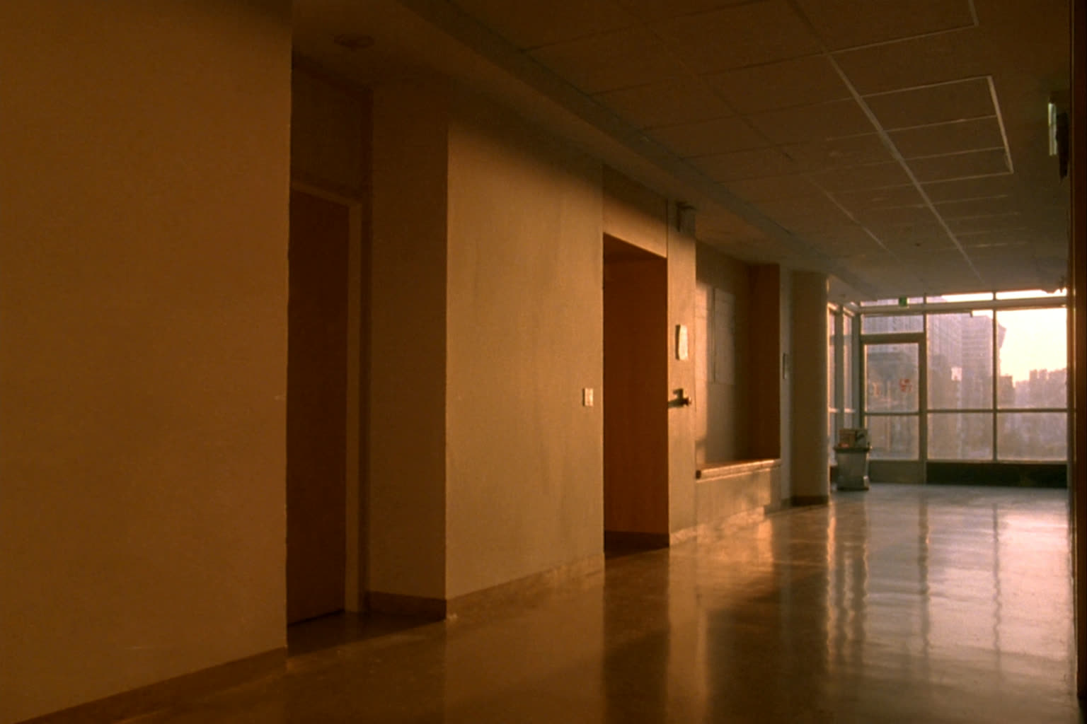 A clinic corridor with consulting rooms along one side