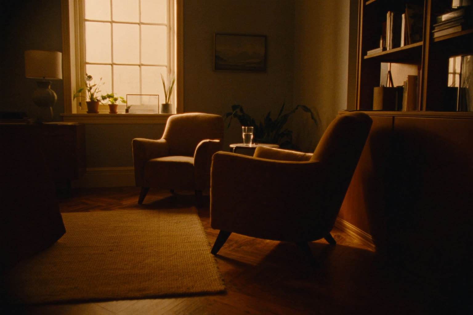 A private therapy office with two armchairs beside a window